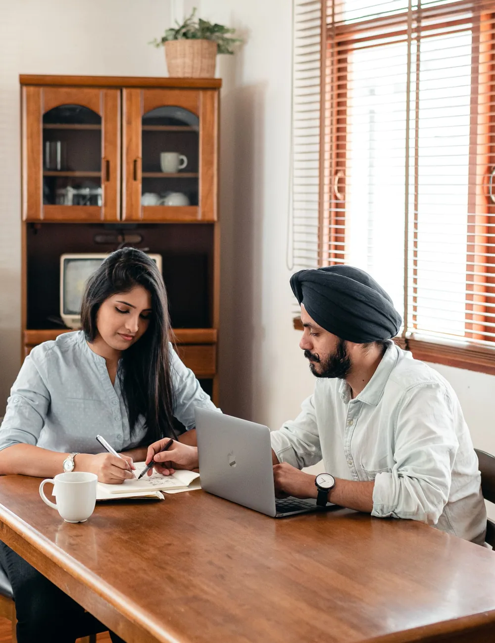A home tutor teaching a student at home